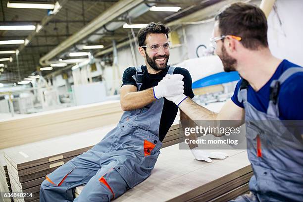 arbeit gut - smiling professional at work tools stock-fotos und bilder