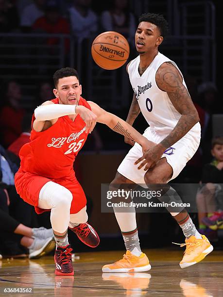 Nick Young of the Los Angeles Lakers guards Austin Rivers of the Los Angeles Clippers during the game at Staples Center on December 25, 2016 in Los...