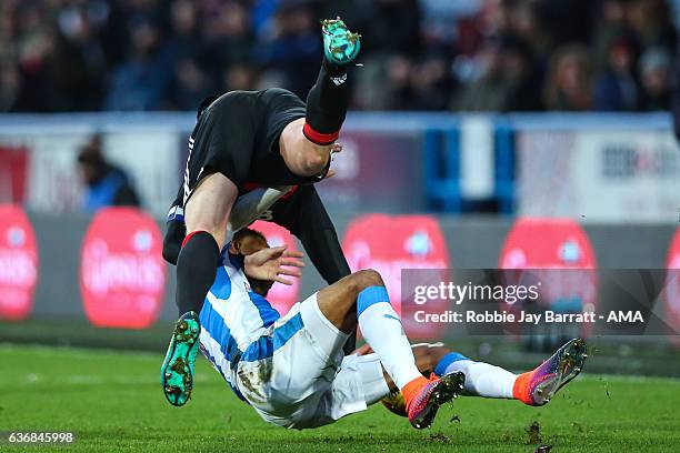 Rajiv Van La Parra of Huddersfield Town with a late tackle on Matthew Mills of Nottingham Forest during the Sky Bet Championship match between...