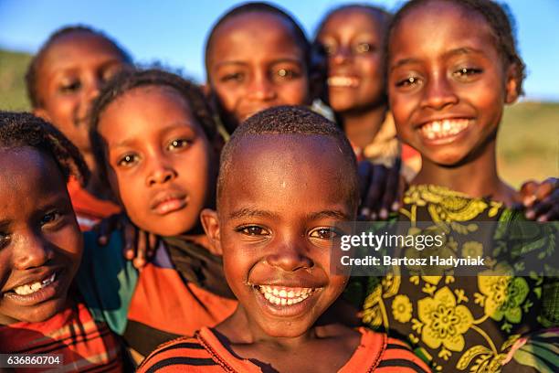 group of happy african children, east africa - poor africans stock pictures, royalty-free photos & images