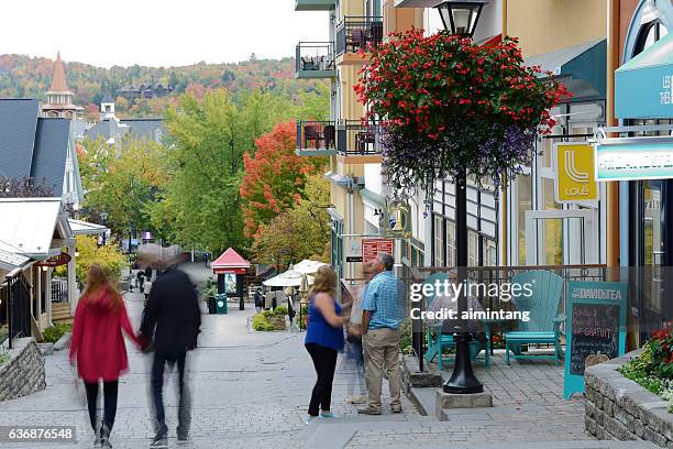 tourists in mont tremblant resort village - mont tremblant stock pictures, royalty-free photos & images