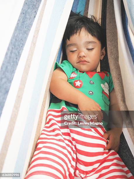 Summer Christmas - Toddler is sleeping inside the hammock