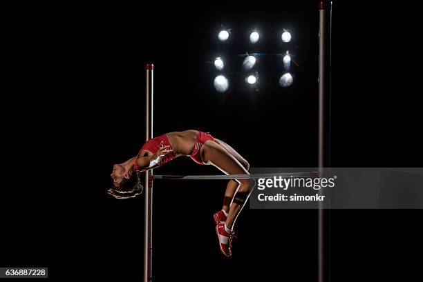 high jumper performing - horizontal bars stock pictures, royalty-free photos & images