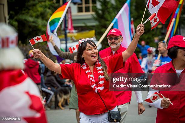 people celebrating canada day. - canada day stock pictures, royalty-free photos & images