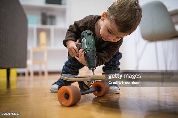 im fixnig this longboard - baby imagination stock pictures, royalty-free photos & images