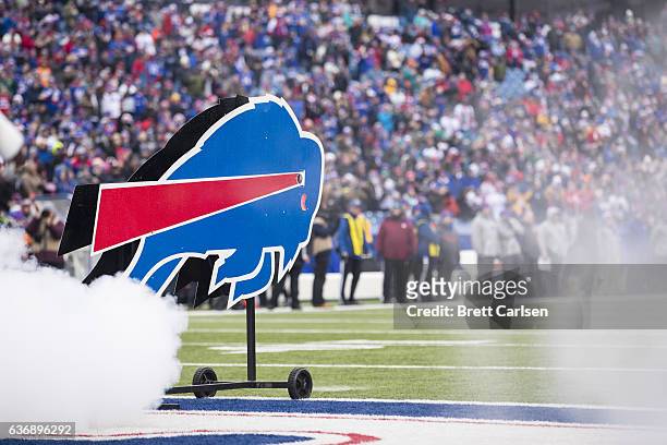The Buffalo Bills logo stands amidst smoke from pregame pyrotechnics before the game against the Miami Dolphins on December 24, 2016 at New Era Field...