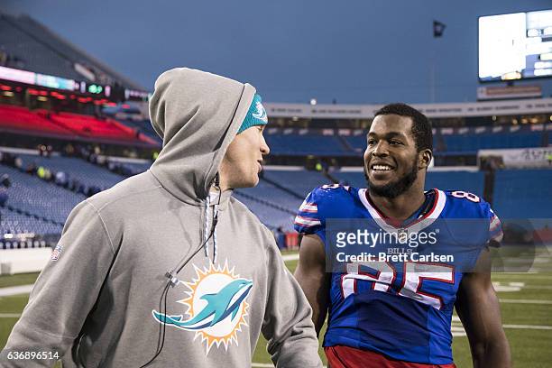 Ryan Tannehill of the Miami Dolphins speaks with Charles Clay of the Buffalo Bills after the game on December 24, 2016 at New Era Field in Orchard...