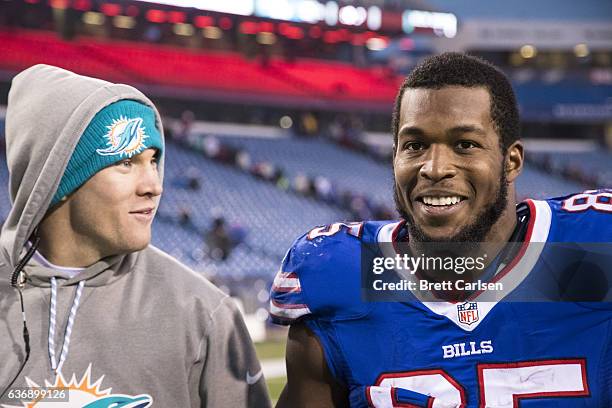 Ryan Tannehill of the Miami Dolphins speaks with Charles Clay of the Buffalo Bills after the game on December 24, 2016 at New Era Field in Orchard...