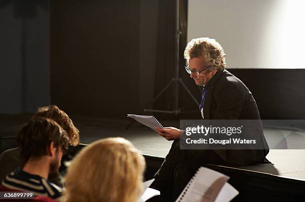 theatre group learning script. - scenario stockfoto's en -beelden