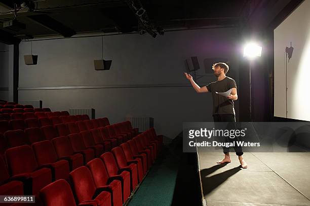 actor rehearsing on stage. - attore foto e immagini stock