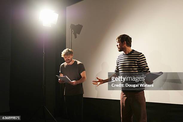 two actors rehearsing on stage. - schauspieler stock-fotos und bilder