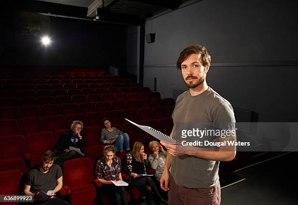 portrait of actor on stage with script. - actor stock pictures, royalty-free photos & images