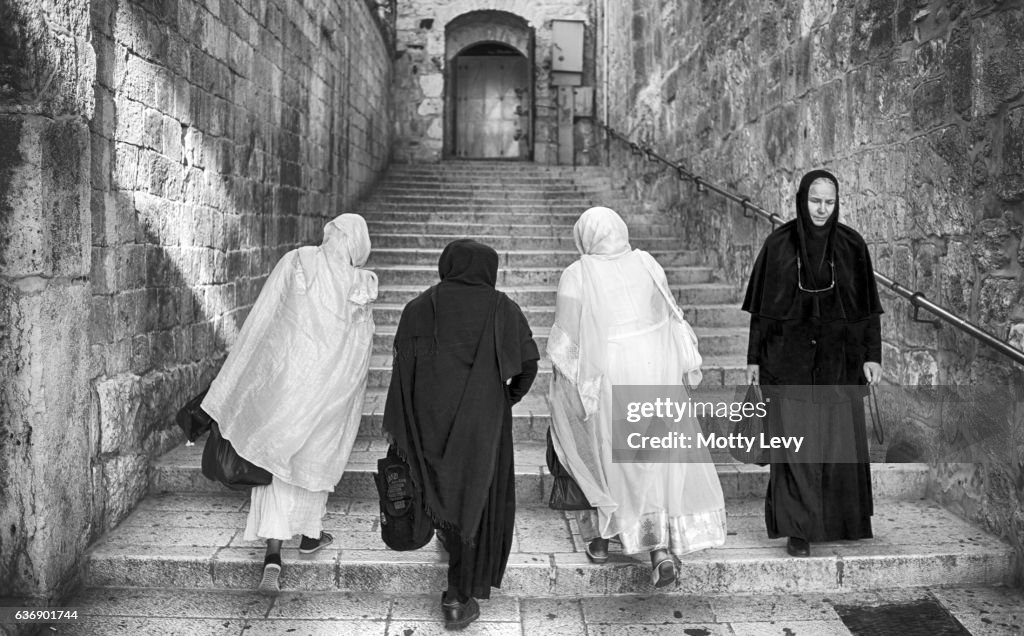 4 Pilgrim women, going up the stairs in Via Delarosa,The Holy City.