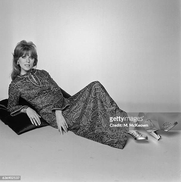 English fashion model Paulene Stone wearing a paisley-patterned kaftan, UK, 4th May 1971.