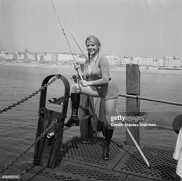 English actress Margaret Nolan on location in Brighton for the filming of 'Carry on at your Convenience', UK, 4th May 1971.