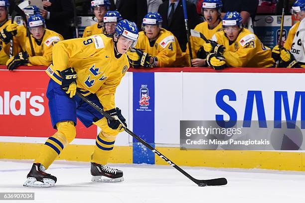 Gabriel Carlsson of Team Sweden skates the puck during the IIHF World Junior Championship preliminary round game against Team Denmark at the Bell...