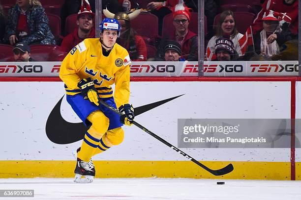 Gabriel Carlsson of Team Sweden skates the puck during the IIHF World Junior Championship preliminary round game against Team Denmark at the Bell...