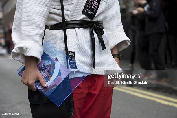 Illustrator Isabella Hemmersbach wears vintage jujitsu jacket, vintage trousers and Marques Almeida bag on day 2 of London Womens Fashion Week...