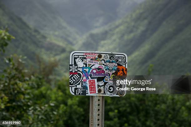 Grafitti and stickers cover a sign at the Pololu Valley Lookout as viewed on December 17 near Kapaau on the Kohala Coast, Hawaii. Hawaii, the largest...