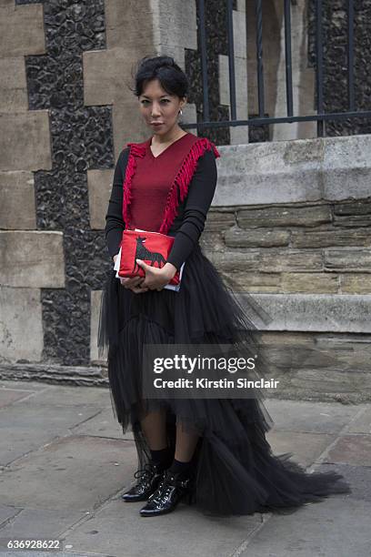 Fashion buyer and owner of the Satine Boutique Jeannie Lee wears Natasha Zinko dress, Balenciaga shoes and Charlotte Olympia bag on day 2 of London...