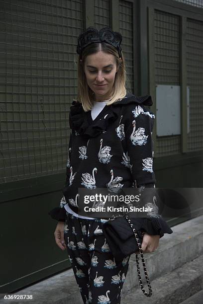 Fashion stylist Natalya M wears Stella McCartney top and trousers, Adidas shoes, Chanel bag and Ganni headpiece on day 2 of London Womens Fashion...