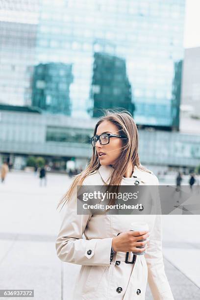 young woman walking on street - boss over shoulder stock pictures, royalty-free photos & images