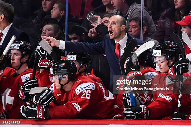 Head coach Christian Wohlwend of Team Switzerland yells out instructions during the IIHF World Junior Championship preliminary round game against...