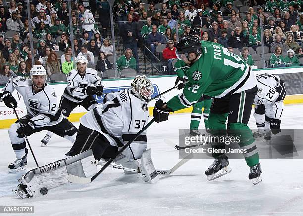 Jeff Zatkoff of the Los Angeles Kings slides over to make a save against Radek Faksa of the Dallas Stars at the American Airlines Center on December...