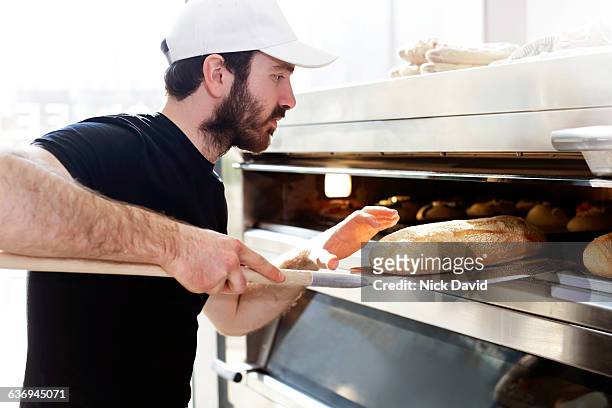 bakers at work - baker stock pictures, royalty-free photos & images