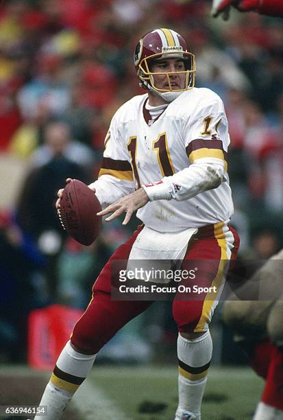 Mark Rypien of the Washington Redskins drops back to pass against the San Francisco 49ers during the NFC Divisional Playoffs January 9, 1993 at...