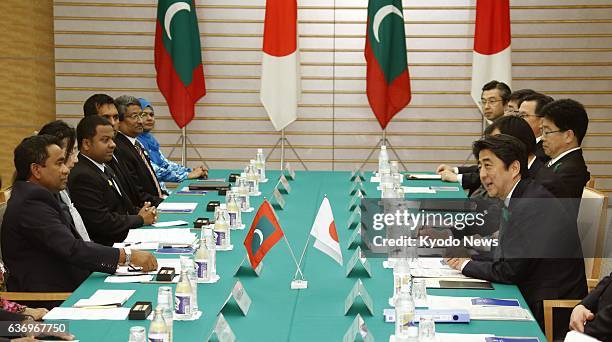 Japan - Japanese Prime Minister Shinzo Abe speaks during a meeting with Maldives President Abdulla Yameen in Tokyo on April 15, 2014.