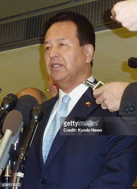 United States - Akira Amari, Japanese minister in charge of the Trans-Pacific Partnership initiative, answers reporters' questions upon arrival at...