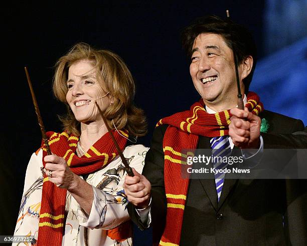 Japan - U.S. Ambassador to Japan Caroline Kennedy and Japanese Prime Minister Shinzo Abe smile during a press event at Universal Studios Japan in...