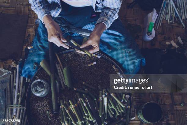 hand made of burmese cigars (cheroots) - cheroot making stock pictures, royalty-free photos & images