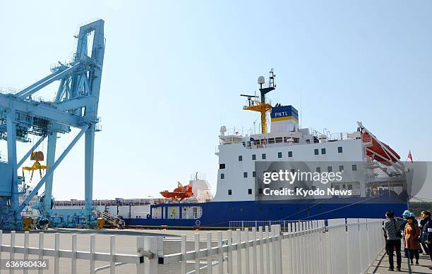 Rokkasho, Japan - A ship carrying a cargo of high-level radioactive waste produced through reprocessing of spent Japanese nuclear fuel in Britain...