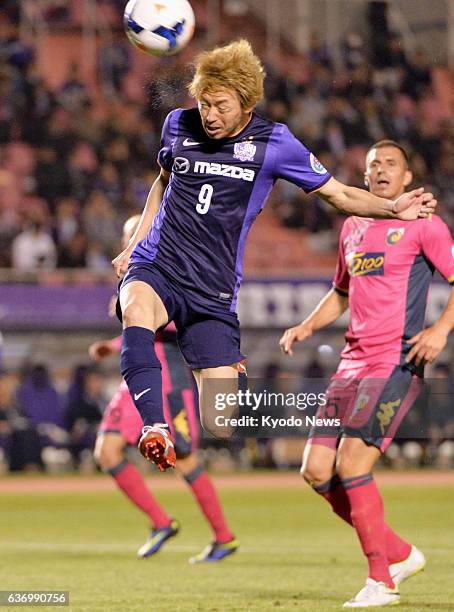 Japan - Naoki Ishihara of Japan's Sanfrecce Hiroshima heads the ball during the first half of a Group F match against Australia's Central Coast...
