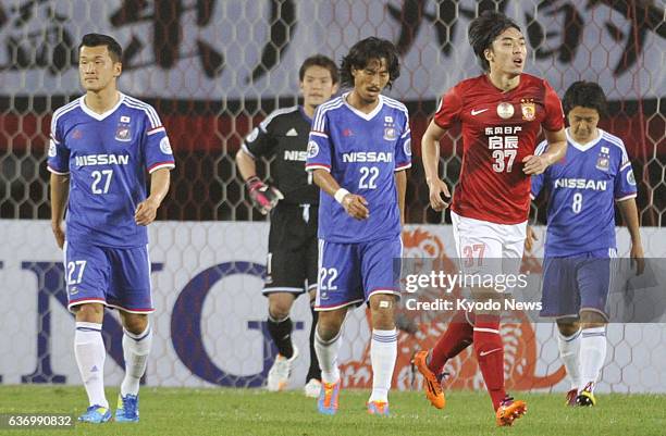 China - Players of Yokohama F Marinos of Japan - Seitaro Tomisawa, Tetsuya Enomoto , Yuji Nakazawa and Kosuke Nakamichi - look discouraged after...