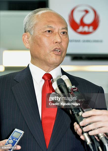 Japan - Tokyo Gov. Yoichi Masuzoe speaks with reporters at Tokyo's Haneda airport before departing for Beijing on April 24, 2014.