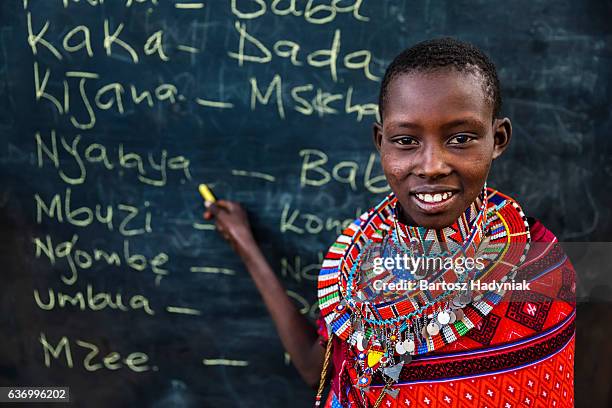 little african girl during swahili language class, east africa - kenyansk kultur bildbanksfoton och bilder