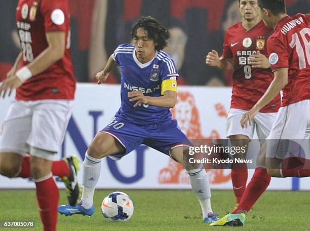 China - Shunsuke Nakamura of Yokohama F Marinos dribbles in the first half of a Group G match of the Asian Champions League against defending...