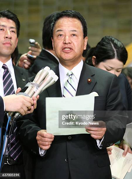 Japan - Akira Amari, minister in charge of Trans-Pacific Partnership trade talks, speaks to reporters about the situation of negotiations with the...