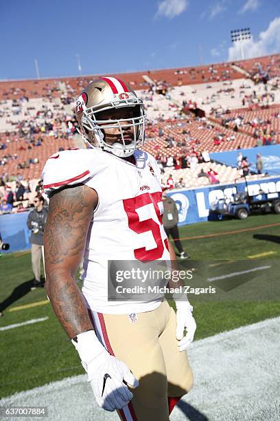 Ahmad Brooks of the San Francisco 49ers stands on the field prior to the game against the Los Angeles Rams at the Los Angeles Coliseum on December...