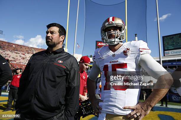 Quarterbacks Coach Ryan Day and Christian Ponder of the San Francisco 49ers stand on the field prior to the game against the Los Angeles Rams at the...