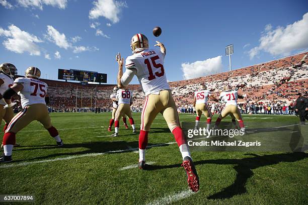 Christian Ponder of the San Francisco 49ers goes through pregame drills on the field prior to the game against the Los Angeles Rams at the Los...