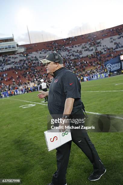 Head Coach Chip Kelly of the San Francisco 49ers stands on the field during the game against the Los Angeles Rams at the Los Angeles Coliseum on...