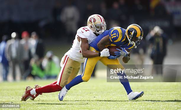 Keith Reaser of the San Francisco 49ers tackles Tavon Austin of the Los Angeles Rams during the game at the Los Angeles Coliseum on December 24, 2016...