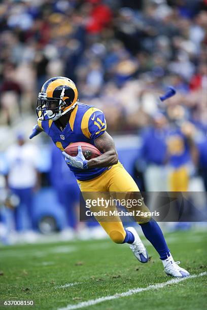 Tavon Austin of the Los Angeles Rams runs an end around during the game against the San Francisco 49ers at the Los Angeles Coliseum on December 24,...