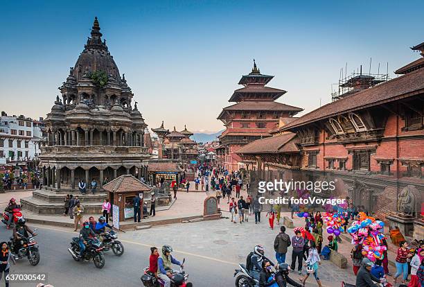 kathmandu crowds of people outside temples patan durbar square nepal - nepal stock pictures, royalty-free photos & images