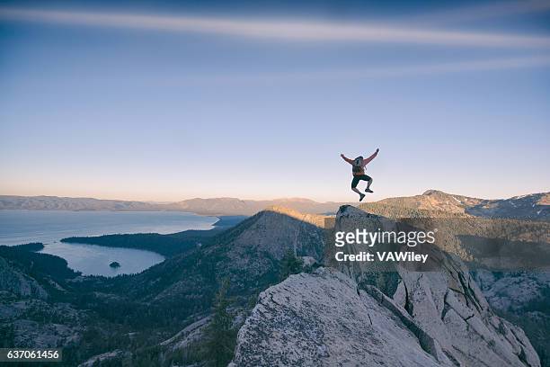 excitment in the mountains - jump joy stock pictures, royalty-free photos & images
