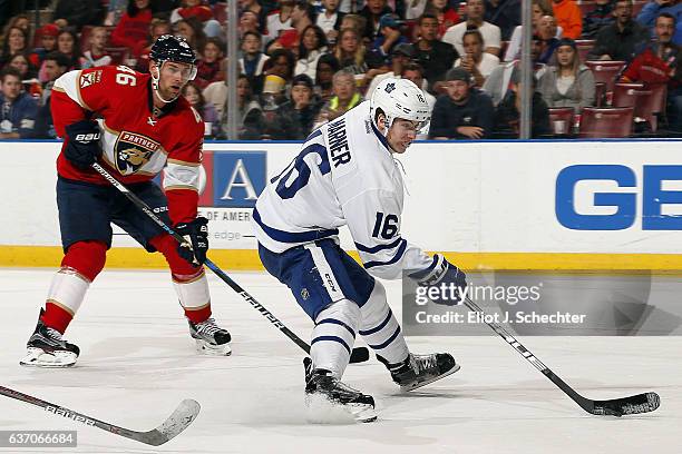 Mitchell Marner of the Toronto Maple Leafs skates with the puck against Jakub Kindl of the Florida Panthers at the BB&T Center on December 28, 2016...